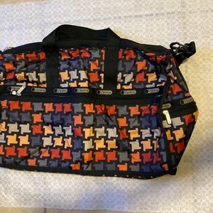 LeSportsac 20x12x10” large duffel bag with strap. multiple colors